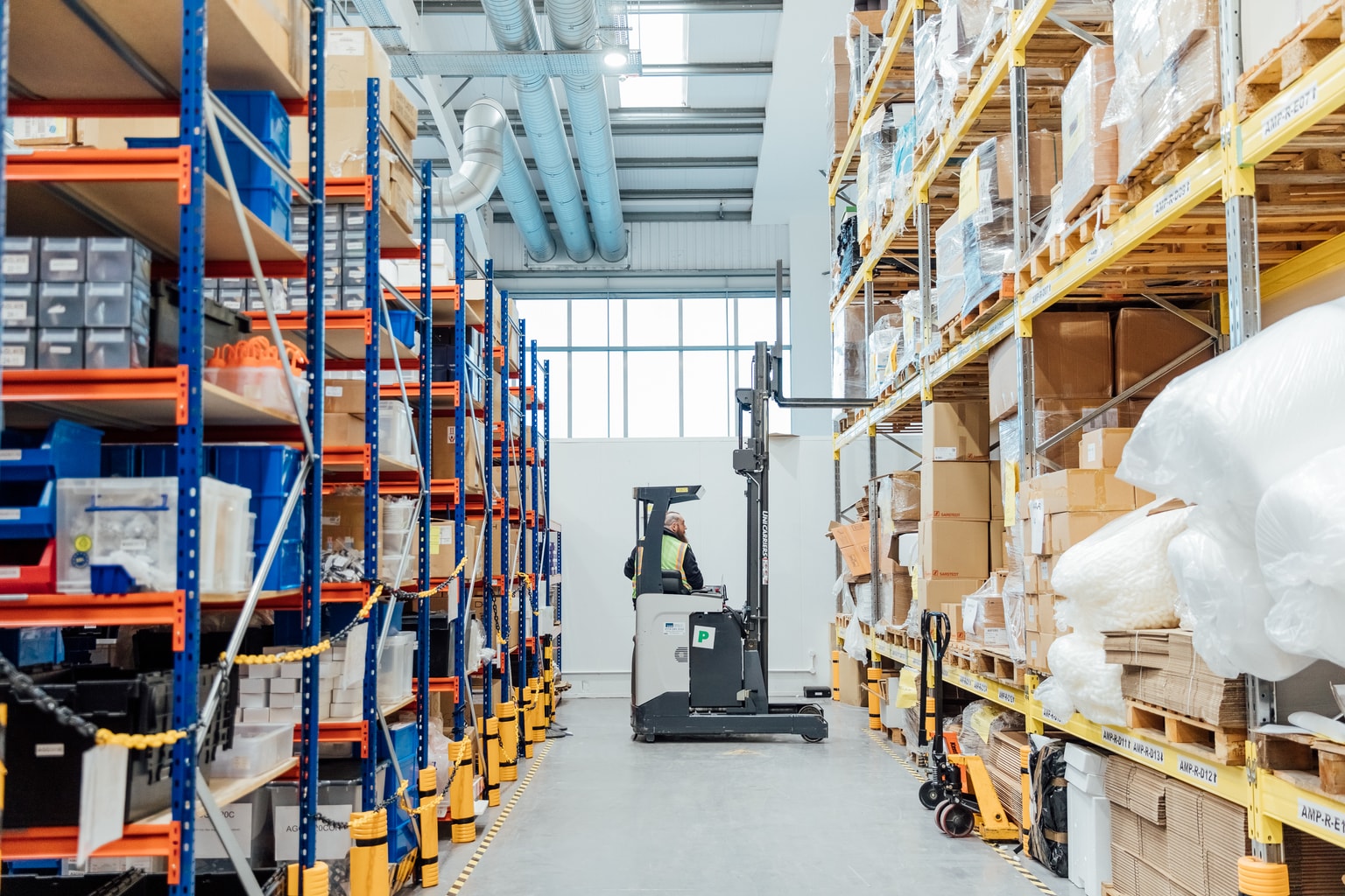 Image of operative by some racks and shelves