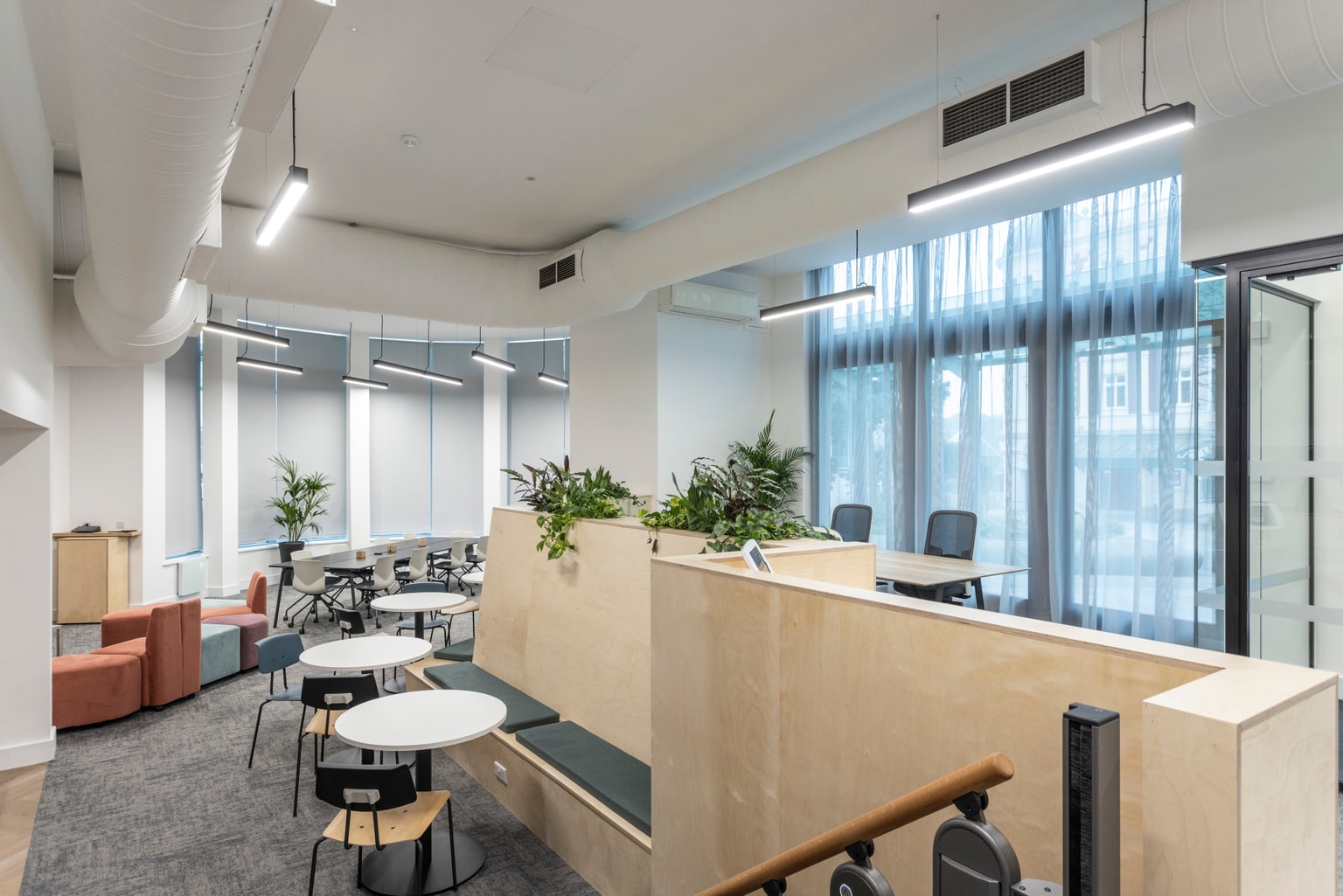 Image of a communal area with tables and seating