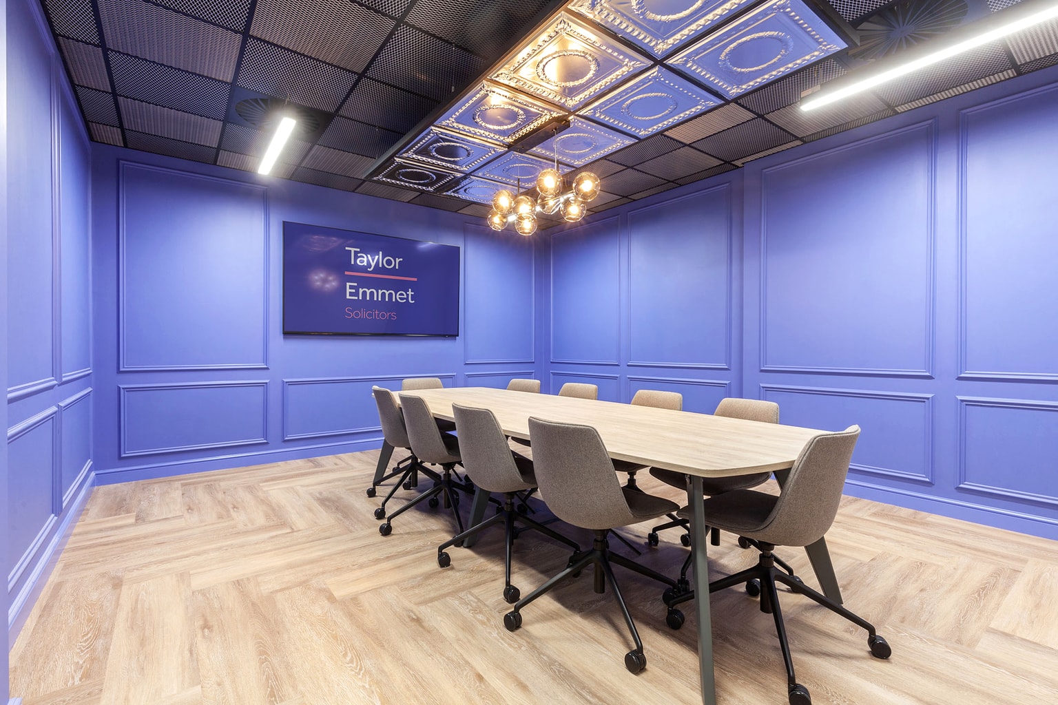 Image of blue boardroom with conferencing unit
