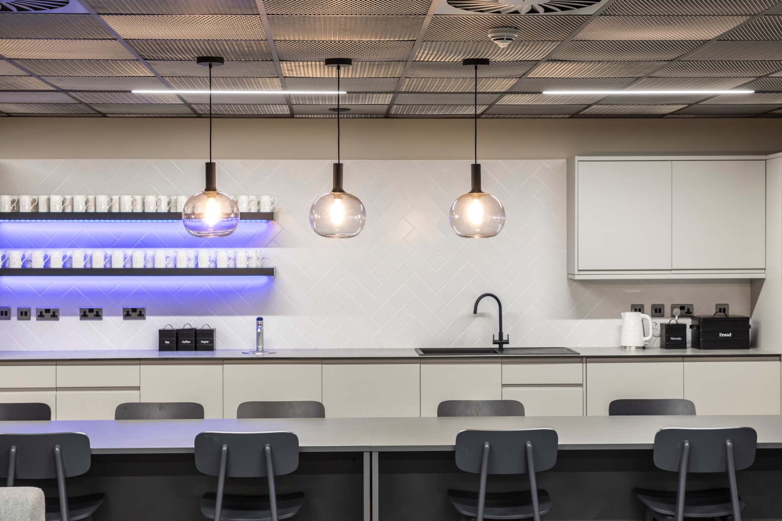 Image of kitchen area with pendant lighting