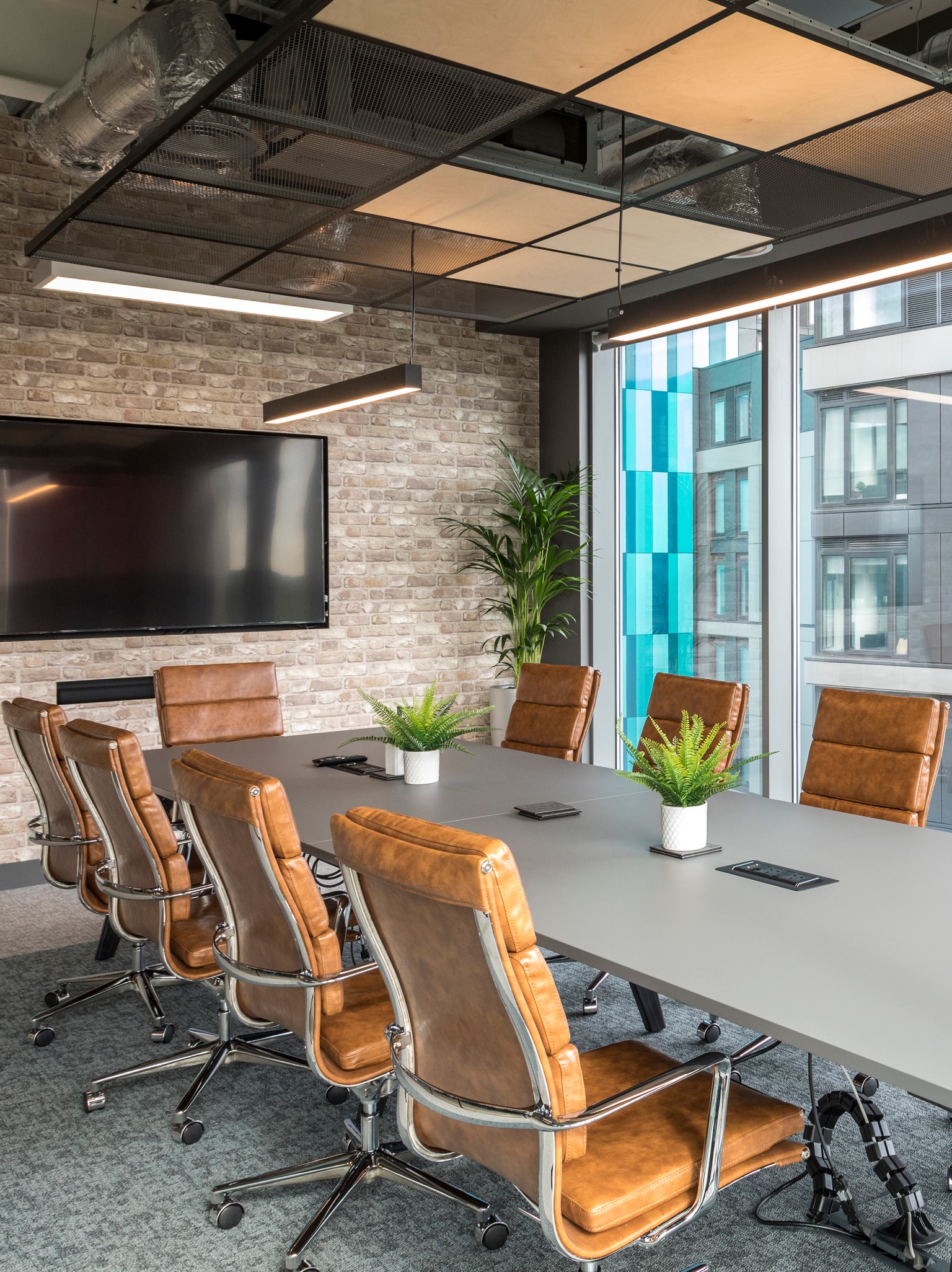 Images of Unihomes office including pool table, office desks and communal areas