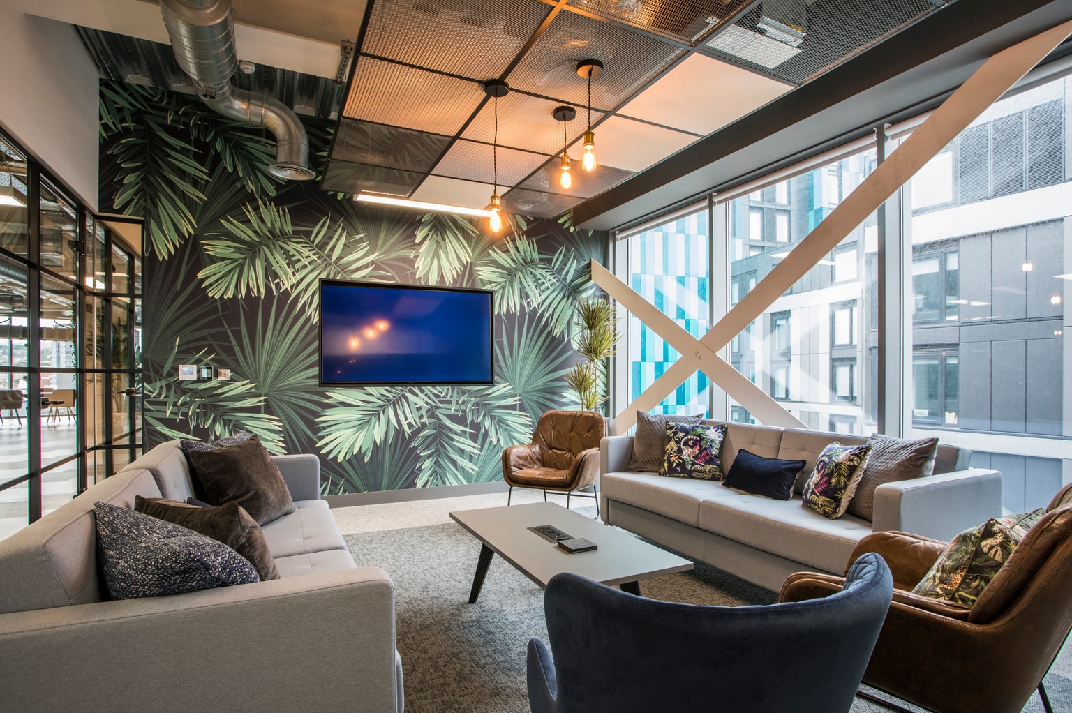 Images of Unihomes office including pool table, office desks and communal areas