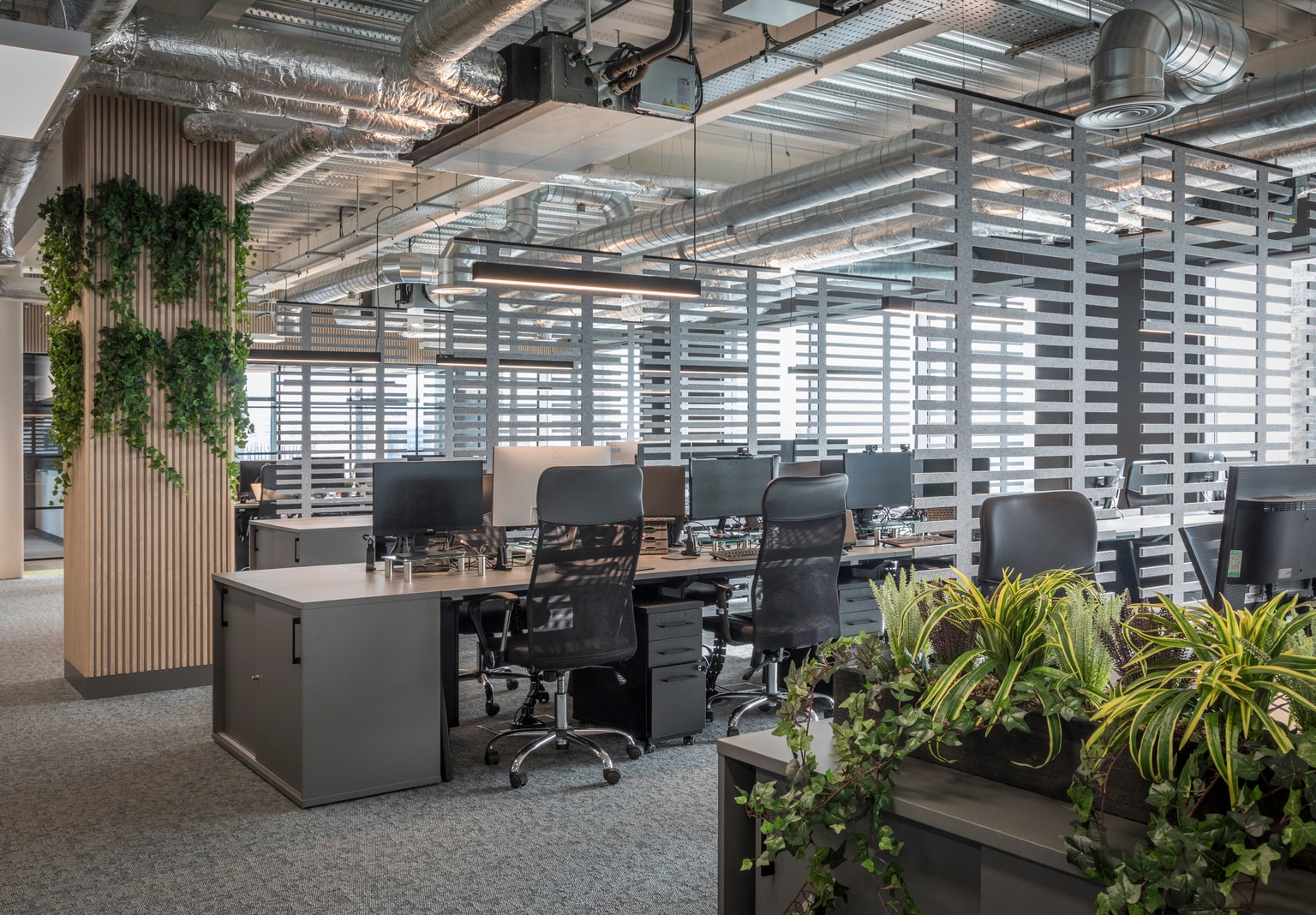 Images of Unihomes office including pool table, office desks and communal areas