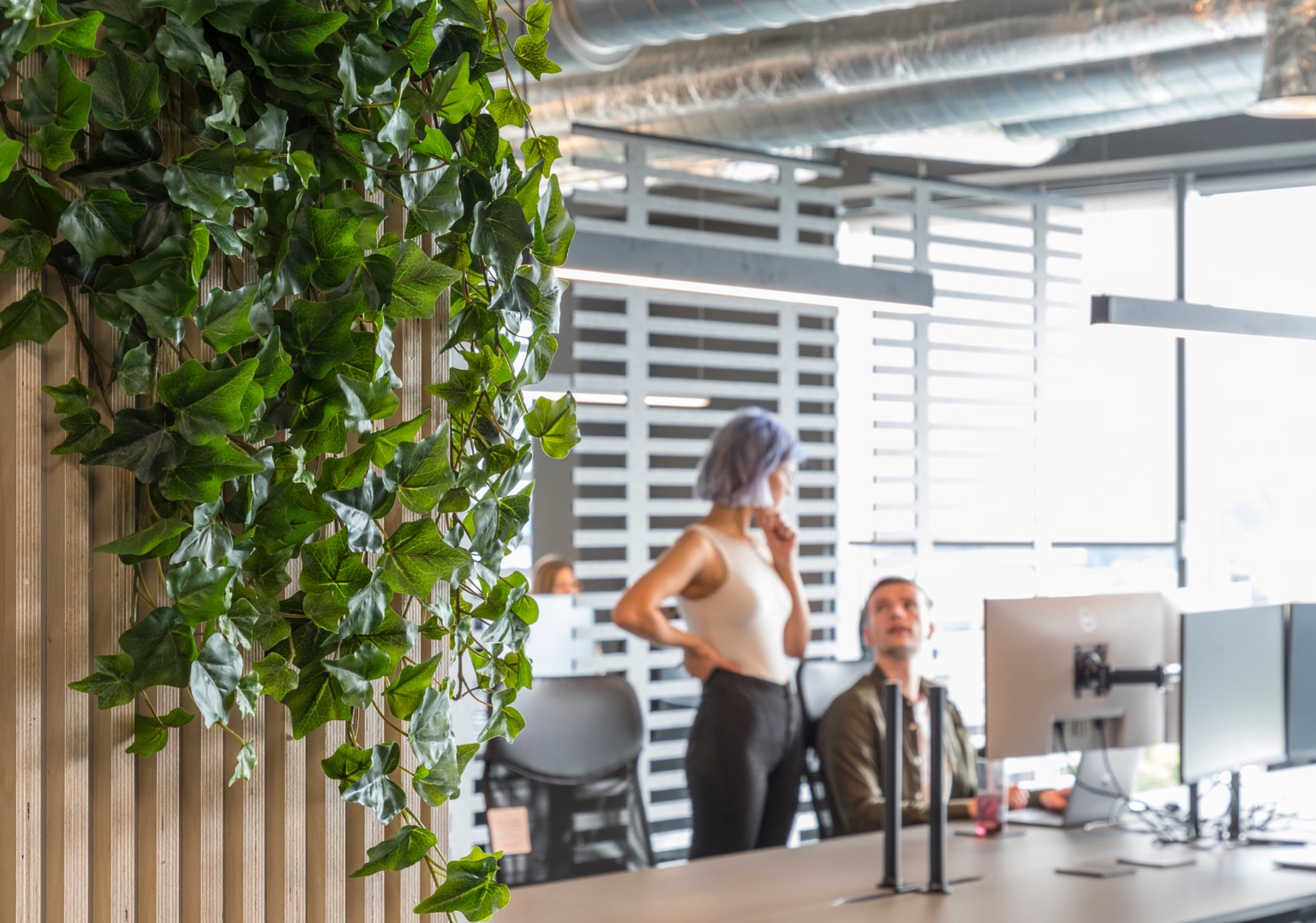 Images of Unihomes office including pool table, office desks and communal areas