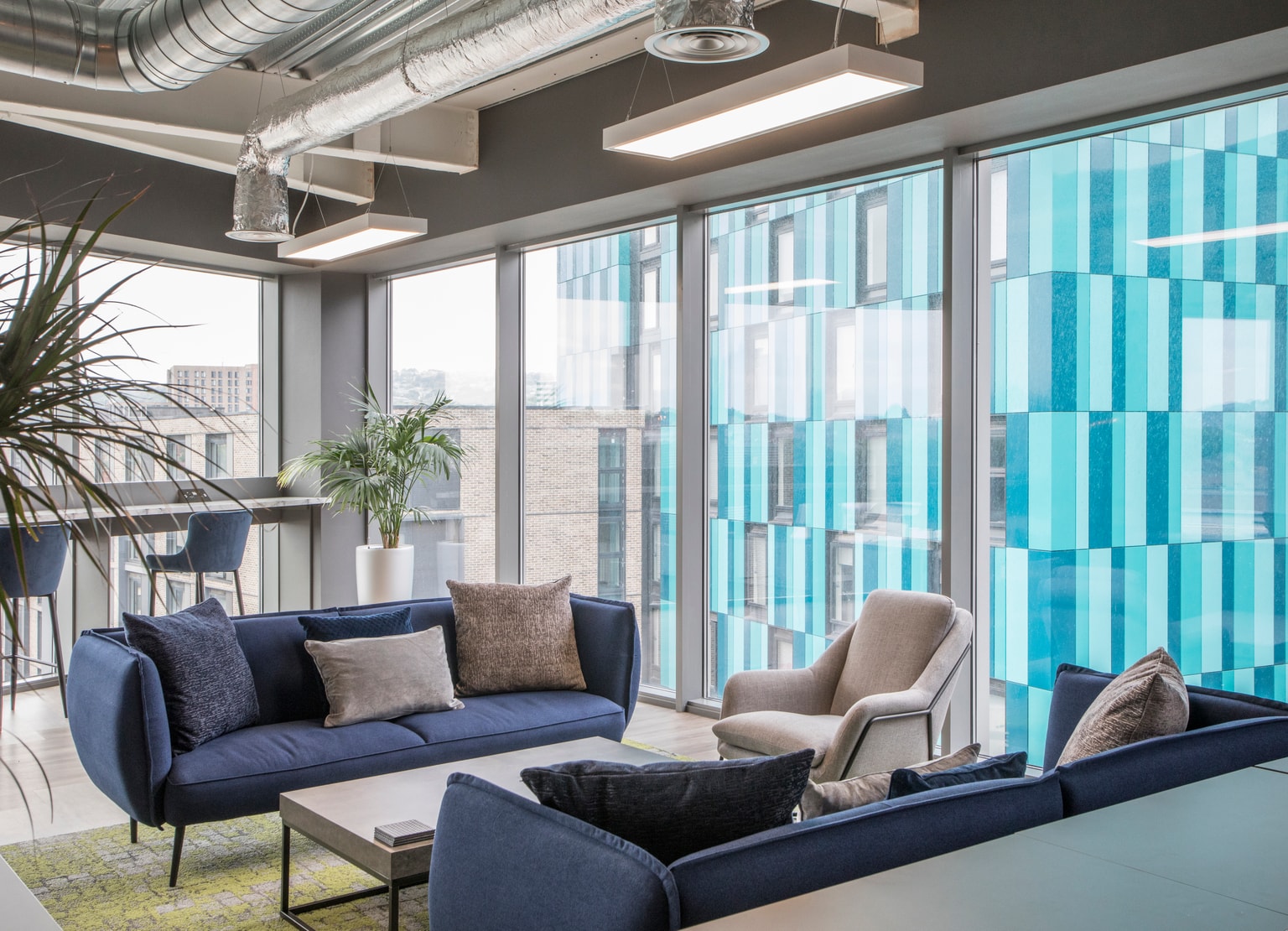 Images of Unihomes office including pool table, office desks and communal areas