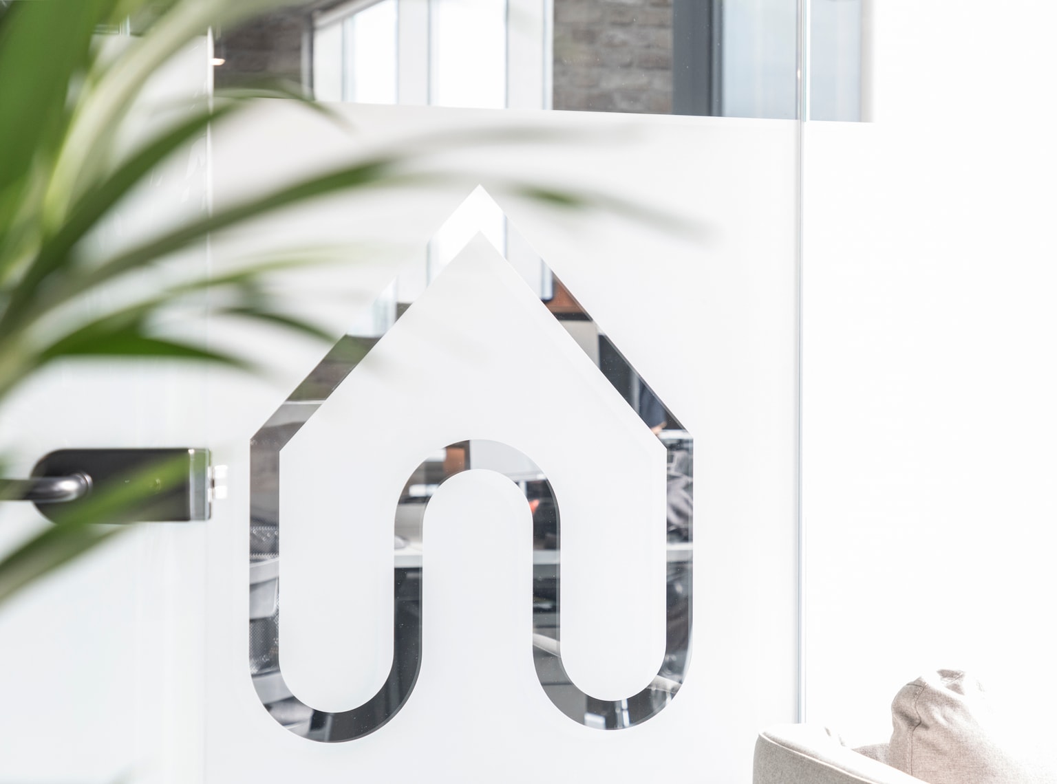 Images of Unihomes office including pool table, office desks and communal areas