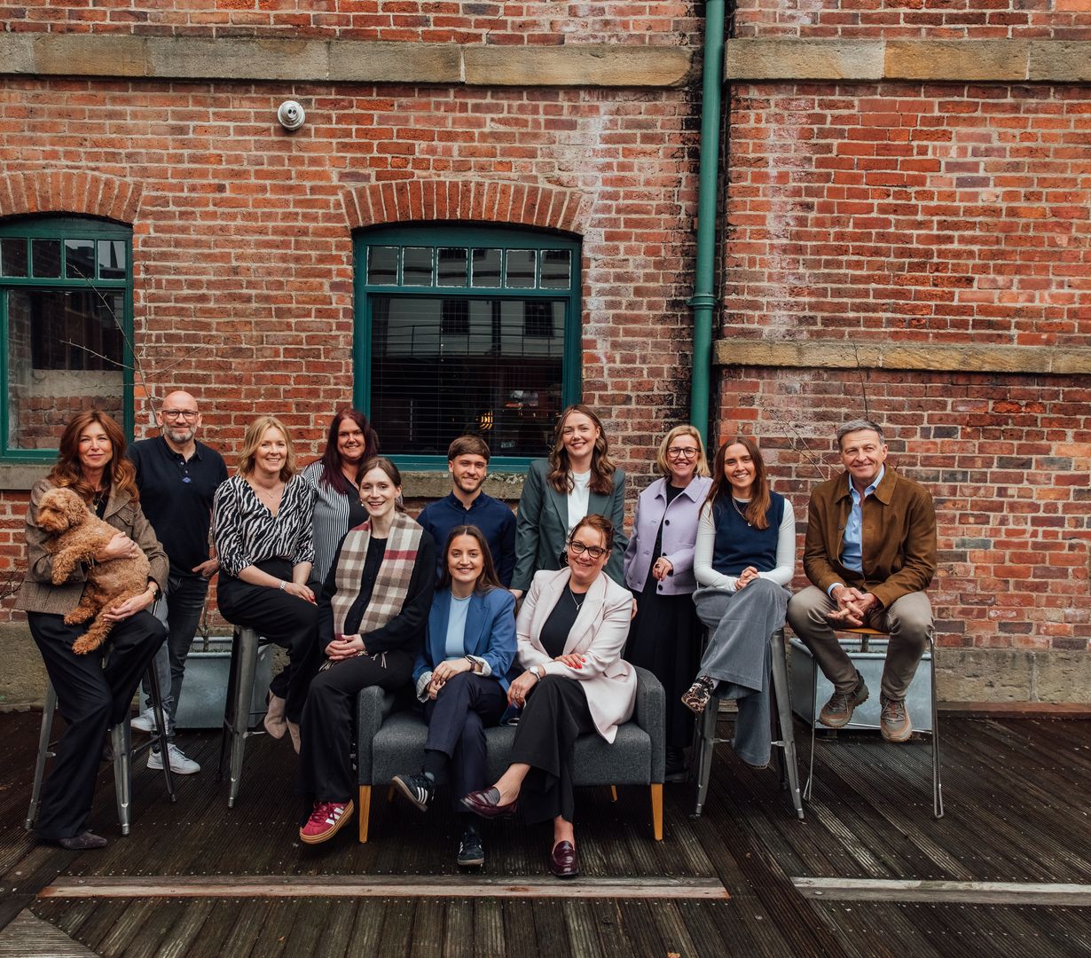 Group photo of the Ovo Space's team outside on the pontoon
